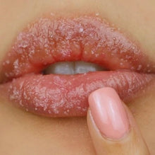 Load image into Gallery viewer, Applying Nayjor Beauty Lip Scrub – Exfoliating lip scrub gently massaged onto lips for smooth, hydrated results.